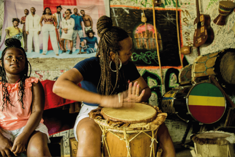 Playing drum with a native